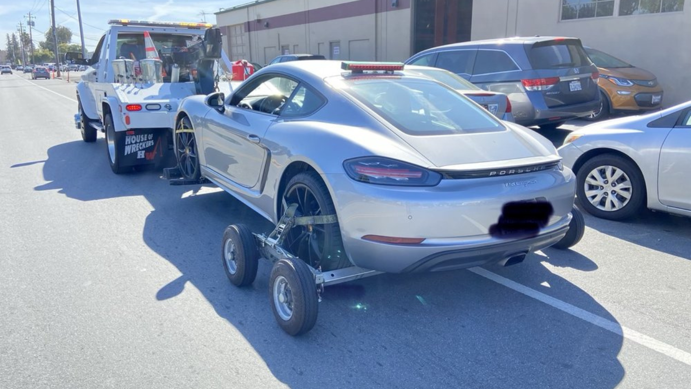 A car being towed by a tow truck